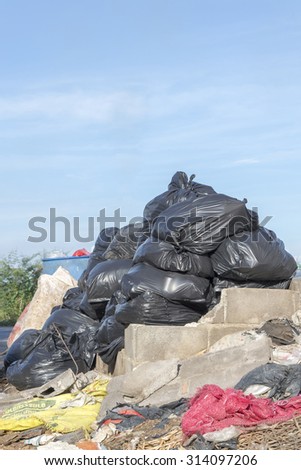 pollution and Disorganized grablage Garbage Disposal and pile of black bags garbage prepare waste disposal, bangkok, thailand
