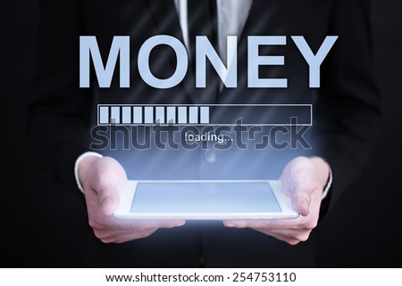 businessman holding a tablet money with loading bar  on the screen. Internet concept. business concept.
