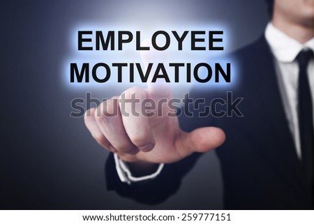Businessman pressing touch screen interface and select employee motivation. business concept