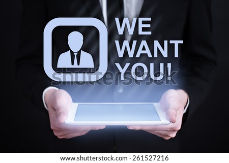 Businessman holding a tablet pc with we want you text on virtual screen . Internet concept. business concept.