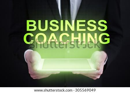 Businessman holding a tablet pc with \