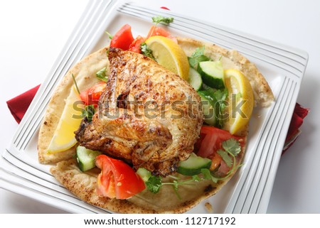 Mid-east style barbecue chicken. Originally an Egyptian dish but now very popular in Israel and other parts of the Middle East, the chicken is marinaded in lemon and spices and served