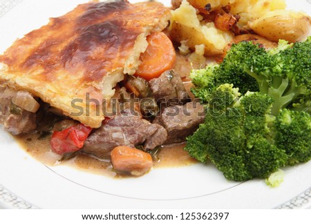 A warming homemade steak and vegetable pie, served with crushed sauteed garlic potatoes and broccoli
