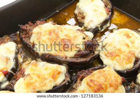 The Greek dish of aubergines stuffed with minced beef, onion and tomatoes, topped with bechamel sauce and cheese, fresh from the oven.