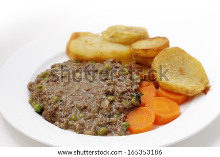 Minced beef cooked with onion, garlic, peas and herbs, served with sauteed potatoes and boiled carrots. This is a simple, slightly old-fashioned British-style meal,