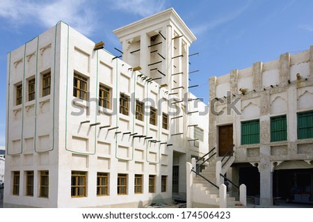 A view of part of the retro-styled architecture, featuring a wind tower, in Souq Waqif, Doha, Qatar.
