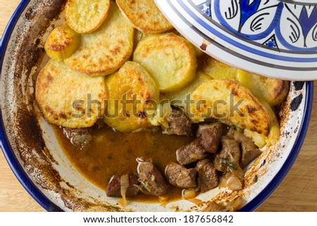 Moroccan sweet potato and beef tagine cooked in the bowl, from above. A traditional dish from Fez