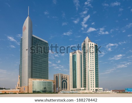 DOHA, QATAR - NOVEMBER 18, 2007: The commercial district of Doha with a sparse scattering of new-built towers in the early stages of the Gulf Emirate\'s building boom.