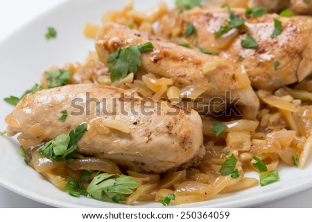 Chicken breasts in an almond, onion and wine sauce, garnished with flat-leaf parsley
