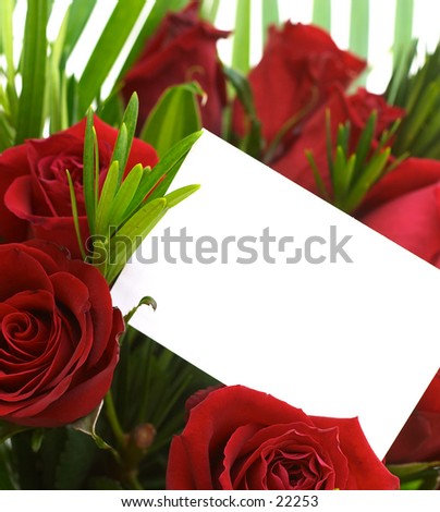 A bouquet of red roses with a blank gift tag.