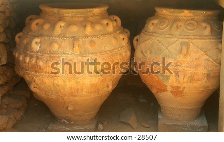 Massive Minoan storage jars, restored and on display at Phaistos archaeological site, Crete. They are almost 2 meters high. From about 3,300 years ago.