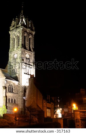 Church, or kirk,  and old pub in Peebles, Scotland, at night.