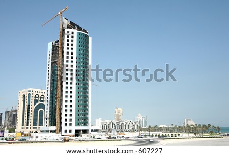 Skyline of Doha, Qatar, New District in October 2005. Doha is being rebuilt at breakneck speed. Please note that this image contains many trademarks or copyrighted logos. It is only for editorial use.