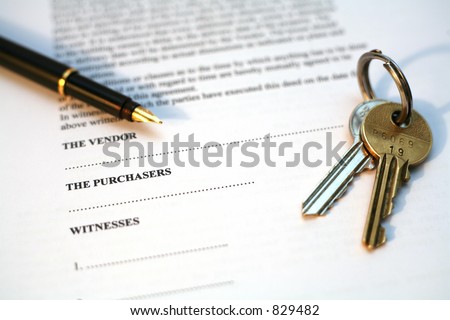 Legal document for sale of real estate property in Europe, with a gold-nibbed fountain pen and house keys