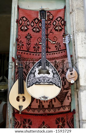 Musical instruments hanging outside an instrument-maker\'s shop in Rethymno, Crete. The traditional cretan lyra, a three-string fiddle, is on the left and the mainland Greek bazouki in the centre