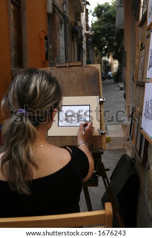 A street artist at work in Rethymno Crete (no model or property release)