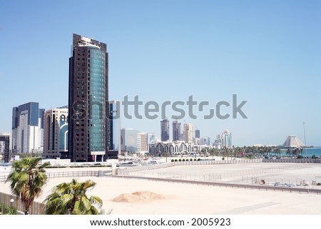 A view of the Doha skyline in October, 2006, showing the high-rise New District, which is still under construction. The building in the foreground suffered a fire.