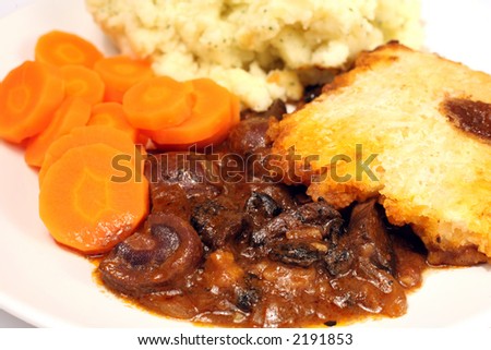 Lamb\'s kidney and mushroom pie with a suet pastry crust, boiled carrots and creamed parsley potatoes.