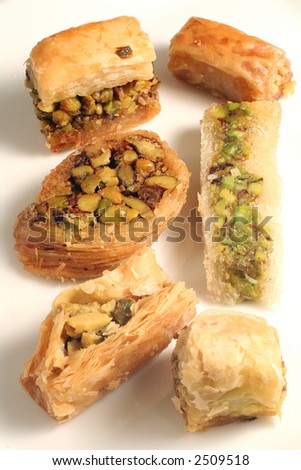 A plate of traditional Arab or Lebanese pastries, which are a popular treat throughout the Middle East and Eastern Mediterranean.