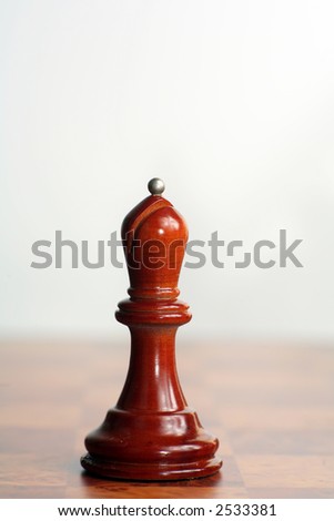 One of a set of images of wooden chess pieces, all shot with the same lighting, DoF, scale and perspective. Each of the white and black pieces is represented in the set.
