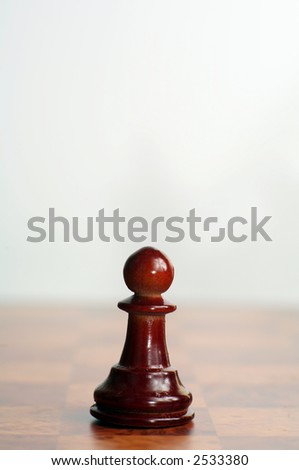 One of a set of images of wooden chess pieces, all shot with the same lighting, DoF, scale and perspective. Each of the white and black pieces is represented in the set.
