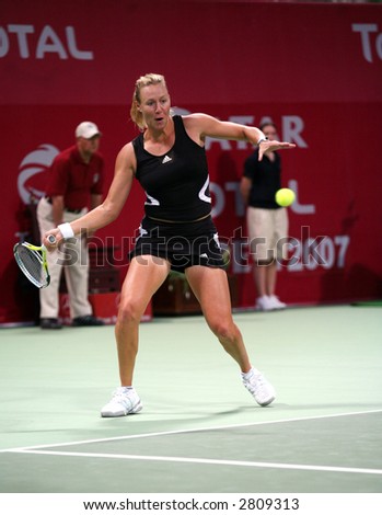 stock photo : Australian tennis star Alicia Molik in action against Justine Henin, at the Qatar Total Open, Doha, February 28, 2007.