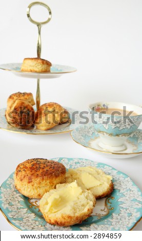Savoury scones and tea with elegant china. A very English tea-time.