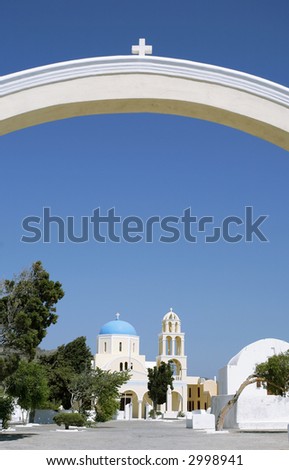 The arch at the entrance to a Greek Orthodox religious community\'s church compound on the Aegean holiday island of Santorini.