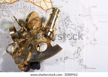 A small brass sextant on an out-of-copyright Ordnance Survey map