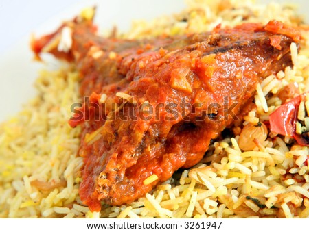 A traditional Gulf Arab fish majboos (fish baked in tomato and onion sauce, with special rice, cooked with saffron, onion, tomato, cardamom, raisins etc), a favourite delicacy on the Gulf coast.