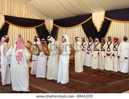 Qatar\'s national folklore troupe perfoming a traditional dance at a cultural event in Doha, April 4, 2007
