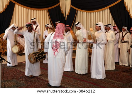 Qatar\'s national folklore troupe perfoming a traditional dance at a cultural event in Doha, April 4, 2007