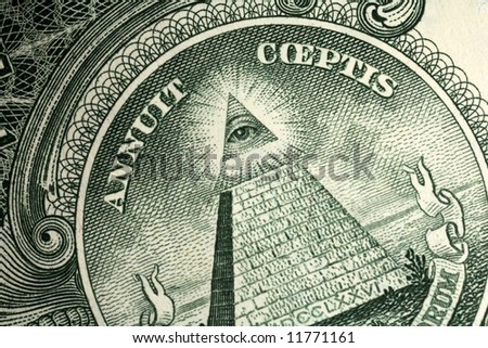 Detail from the one dollar bill, showing the pyramid with eye and the inscription Annuit Coeptis  (we won)