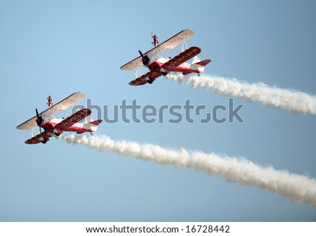 LOWESTOFT, Suffolk - July 24, 2008: Team Guinot air display team, the world\'s only formation wingwalkers, in action at the Lowestoft Air Show. The show is a major annual aviation event