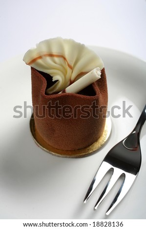 Close-up on an individual petit four gourmet chocolate cake