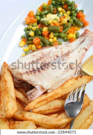 A meal of grilled Red Snapper, fried potato chips and mixed veg, vertical orientation.