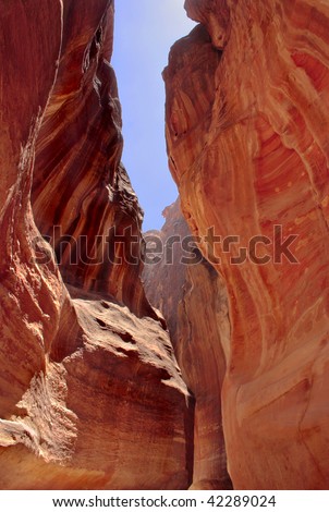 The Siq path slot canyon that is the usual entrance to the hidden city of Petra in Jordan.
