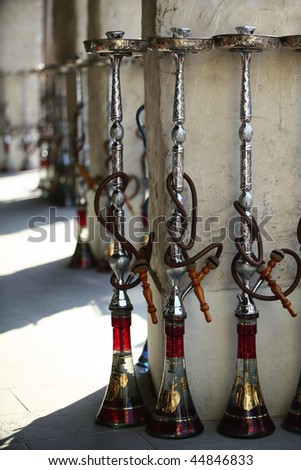 Shisha (hookah) pipes lined up outside a restaurant in Doha\'s Souq Waqif ready for customers. Shisha smoking has become popular among expatriates as well as locals