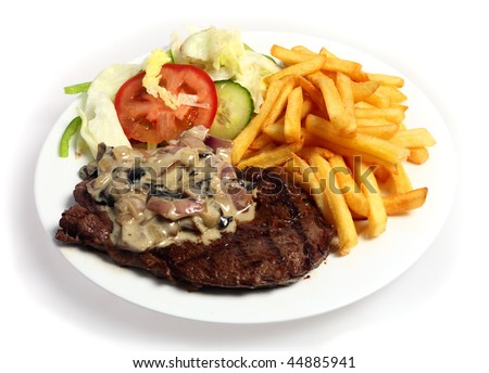 A meal of grilled steak topped with a mushroom and onion in cream sauce, served with French fried potato chips and a salad
