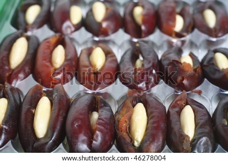 A box of dates that have been pitted and stuffed with almonds, a typical Arabian sweet treat