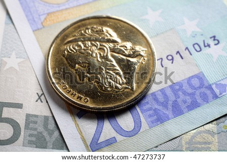 The bust of the writer Homer (Omiros) on a 50 drachma coin lying on euro banknotes. The story of the single currency is starting to look like a Greek tragedy. Will the drachma make a comeback?