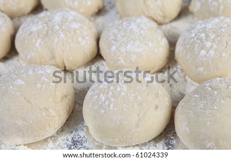 A tray of breakfast rolls rising just prior to baking