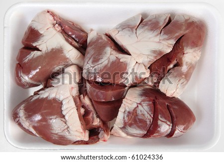 Five lamb hearts on an expanded polystyrene supermarket tray