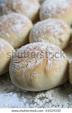 Vertical view of freshly home-baked baps or scottish morning rolls, straight from the oven