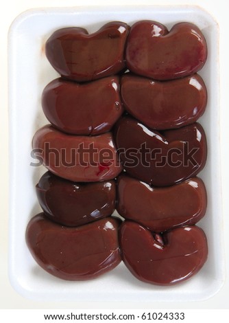 A polystyrene supermarket tray of lamb\'s kidneys seen from above
