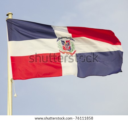 The flag of the Dominican Republic flying over Doha, Qatar, during an international conference.