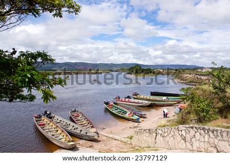 Stop of boats on river in way to waterfall Aponwao in Gran Sabana, Venezuela