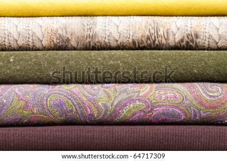 Stack of colorful wool and felt textile rolls