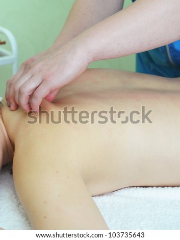 Closeup photo of massage of female back