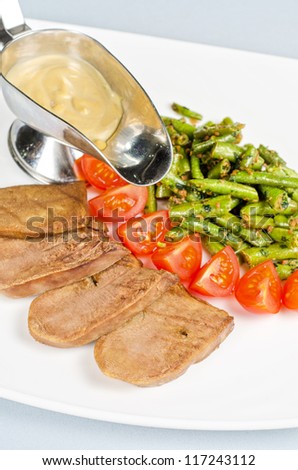grilled beef tongue with green beans and tomato cherry